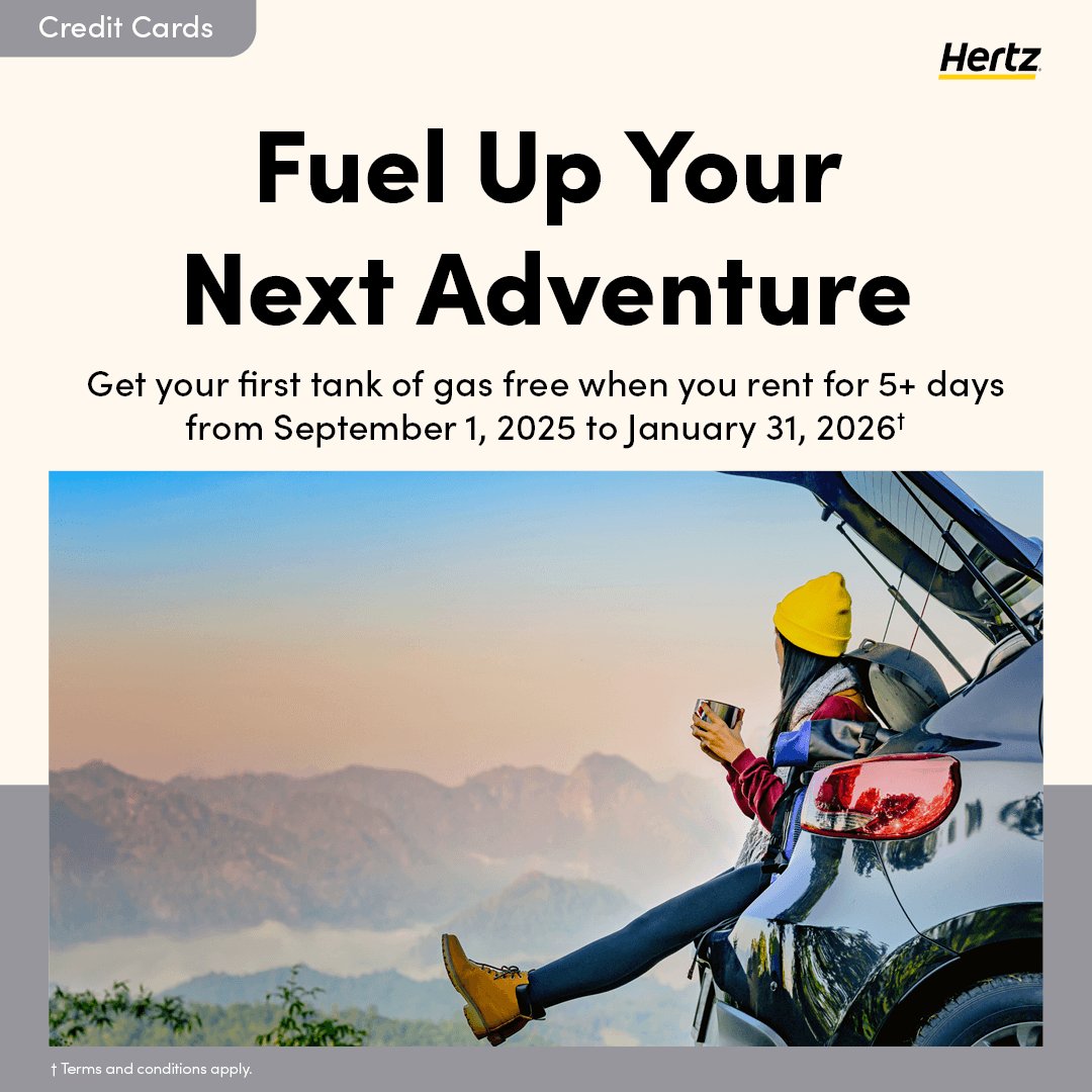 Fuel up your next adventure with Hertz. Woman siging on the edge of a hatchback car.